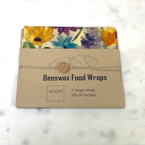 May include: A brown paper package with a floral patterned beeswax food wrap inside. The package says "Beeswax Food Wraps" and "14"x"14" 1 large wrap 14x14 inches.