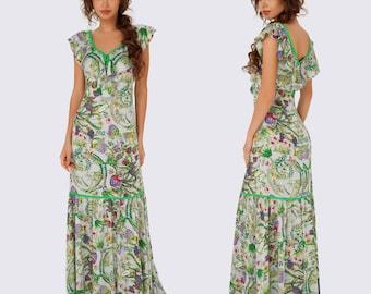 May include: A white maxi dress with a green floral print and green trim. The dress has a V-neckline and short sleeves.