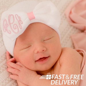 Melondipity Monogrammed White Bow Newborn Girl Hospital Hat with Pink Center and Monogram | Double Ply Extra Warmth and Comfort