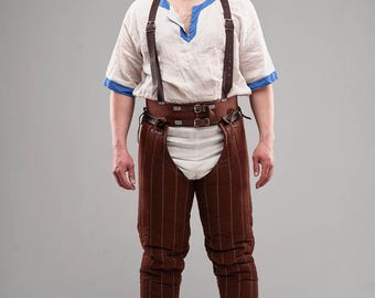 May include: A person wearing brown quilted leg armor with a leather belt and suspenders. The armor is worn over a white shirt and white undergarments.
