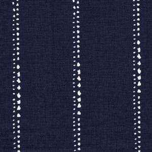 May include: A dark navy blue fabric featuring a repeating pattern of vertical stripes. Each stripe is composed of two parallel lines of small, irregular white dots that create a textured, hand-drawn appearance against the solid dark background.
