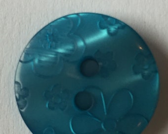 Botón floral en relieve turquesa - 2 agujeros - 2 cm de diámetro - plástico