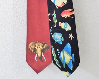 Animal Lover's Duo of Neckties from the 80's. The Land tie is an Elephant, The Sea tie is ocean Fish.