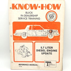 May include: A vintage Buick service training manual titled "KNOW-HOW." The cover is orange and white, featuring a car diagram and text: "5.7 Liter Diesel Engine Update." Includes the Buick logo and reference manual information.