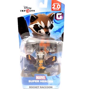 May include: A Rocket Raccoon action figure from Marvel Super Heroes, packaged in a Disney Infinity 2.0 Edition box. The figure is in a clear plastic case, with a blue and orange background. The box features the Disney Infinity and Marvel logos.
