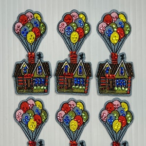 May include: Six embroidered patches featuring a brown house with a red chimney and a white door, lifted by a cluster of colorful balloons. The balloons are decorated with sequins and are in shades of red, yellow, blue, green, and pink.