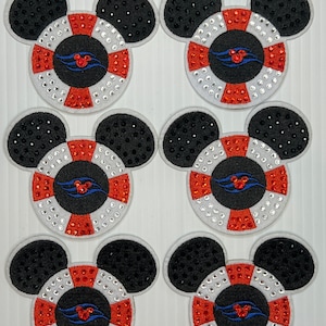 May include: Six Mickey Mouse-shaped patches. Each patch features a white and red life preserver design with a blue and red emblem, surrounded by sparkling rhinestones. The ears are black with a dotted texture.