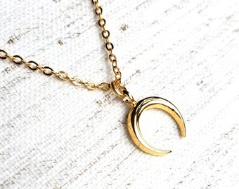 Gold plated necklace with gold plated crescent charm; minimal layering necklace with crescent moon charm; celestial necklace