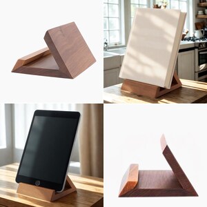 May include: Wooden tablet and book stands in various shades of brown. The stands have a triangular base and a slanted back to hold items upright. The tablet stand is holding a black tablet. The book stand is holding a white book.