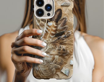May include: A beige and brown iPhone case with a feather design and a gold camera lens cover.