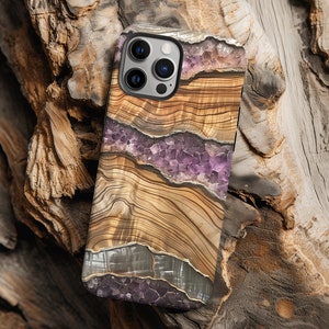 May include: A phone case with a wood grain pattern and purple amethyst crystals. The case is designed to fit an iPhone.