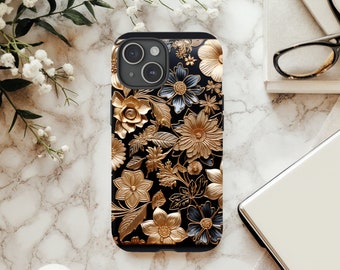 May include: A black phone case featuring a gold floral design. The flowers are embossed and have a 3D effect. The case has a cutout for the camera lens.