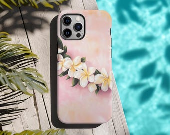May include: A pink phone case with a white floral design. The flowers are arranged in a circle and have a green stem. The phone case has a black border and a camera cutout.