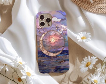 May include: A phone case with a stained glass design featuring a crescent moon, stars, and a sunset over a body of water. The case is made of a clear material and has a purple, pink, and blue color scheme.