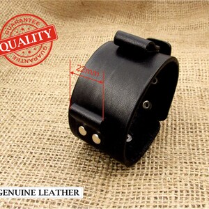 May include: Black leather bracelet with a buckle closure and silver rivets. The bracelet is 22mm wide.  GENUINE LEATHER.