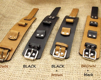 May include: Four leather watch bands in different color combinations. The bands are brown, black, black with brown accents, and brown with black accents. Each band has a buckle closure and multiple decorative straps.