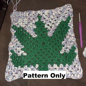 May include: Crochet pattern for a green leaf design with a white and purple border. The pattern is written "Pattern Only".