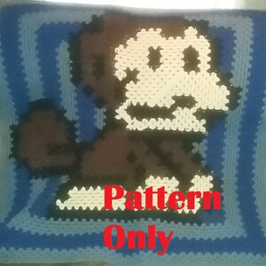 Könnte beinhalten: Häkelmuster für einen blauen, weißen und braunen Affen. Das Muster ist zum Verkauf, nicht das fertige Produkt. Der Text "Pattern Only" ist im Bild sichtbar.