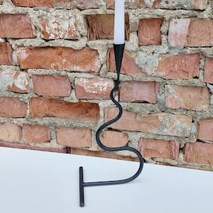 Hand-forged wavy iron candle holder with a sleek minimalist design, adding a unique and artistic touch to your home decor. Perfect Gift