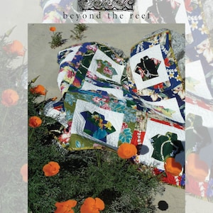 May include: A quilt with a Hawaiian theme featuring a patchwork of colorful floral and tropical prints. The quilt is folded and lying on a sandy beach with orange flowers in the foreground. The text "aloha shirts" and "@quiltedorigami" is visible at the bottom of the image.