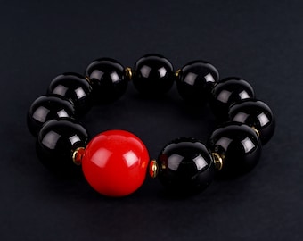 BLK18S: Black Onyx with red Cinnabar Bracelet