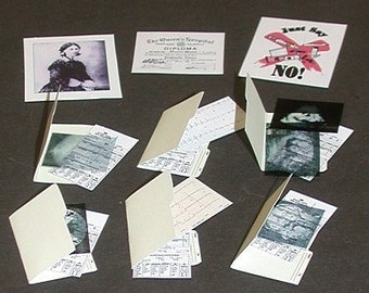 May include: A collection of vintage medical documents and papers, including a diploma from The Queen's Hospital, a photo of a woman in a nurse's uniform, and a document with the text "Just Say NO!"  The documents are arranged on a brown surface with a ruler and a penny.