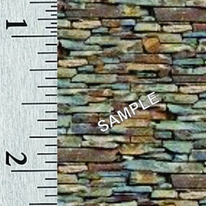 May include: A close-up of a stone wall with a ruler in inches for scale. The wall is made of various shades of brown, gray, and blue stones. The text "SAMPLE" is printed three times on the image.