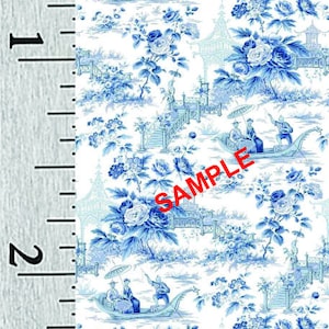 May include: Blue and white floral fabric with a repeating pattern of flowers, pagodas, and boats. The fabric is on a white background and has a ruler in inches along the left side.