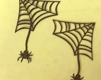 May include: Two brown wooden spider web cutouts with spiders hanging from the bottom. The webs are intricately detailed and have a rustic look.