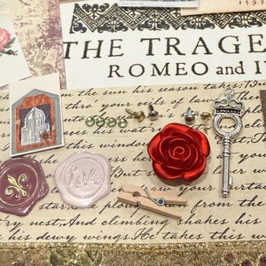 May include: A collage of vintage-style ephemera, including a red satin rose, a silver key charm, and wax seals. The text "THE TRAGE ROMEO and I" is visible, along with other handwritten script and a decorative border.