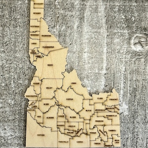 État numérique de l'Idaho avec carte des comtés Fichier de puzzle SVG, PDF, DXF et EpS, gravure et découpe au laser