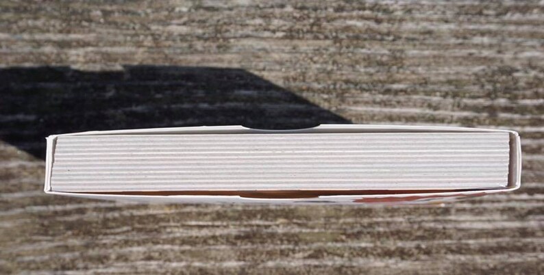 May include: A white cardboard box with a slightly textured surface. The box is closed and appears to contain a set of items.