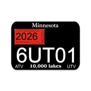May include: Black ATV and UTV registration decal for Minnesota, featuring the state name and "10,000 lakes." The decal includes the year 2026 in red, with the text "Expires DEC 31, 2028."