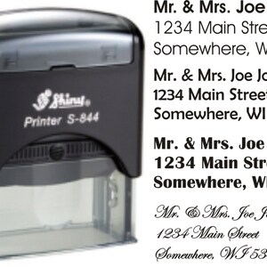May include: A black self-inking stamp with the text "Shiny Printer S-844" and the name and address "Mr. & Mrs. Joe Johnson 1234 Main Street Somewhere, WI 53444" printed in black.