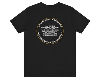 May include: Black t-shirt with a gold circle graphic on the back. The graphic features the text "In the moment of crisis I am... The voice within the trenches".