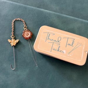 Thread Tail Tucker w/Storage Tin