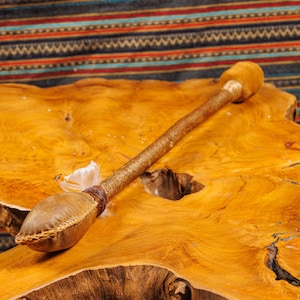 Tan shamanic beater-rattle with dragonstone crystals
