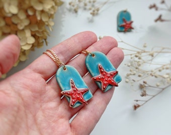 Handmade ceramic pendant with starfish