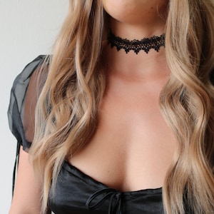 Black lace choker with silver clasp on a model - pyrado jewelry store 
lace choker collar
black lace choker necklace