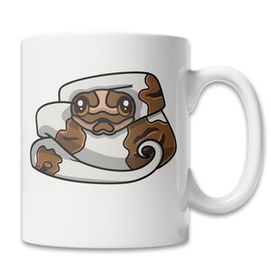 May include: White ceramic coffee mug with a cartoon illustration of a brown and white snake with big eyes. The snake is curled up in a ball.