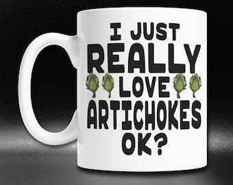May include: White ceramic mug with a black graphic that says "I just really love artichokes ok?" with three green artichoke illustrations.