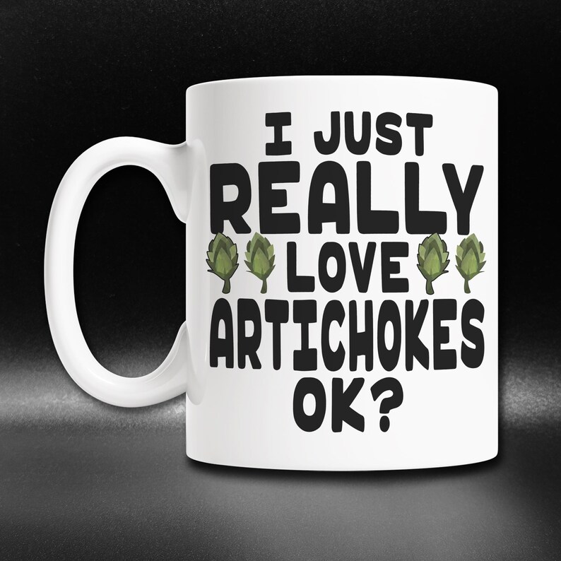 May include: White ceramic mug with a black graphic that says "I just really love artichokes ok?" with three green artichoke illustrations.
