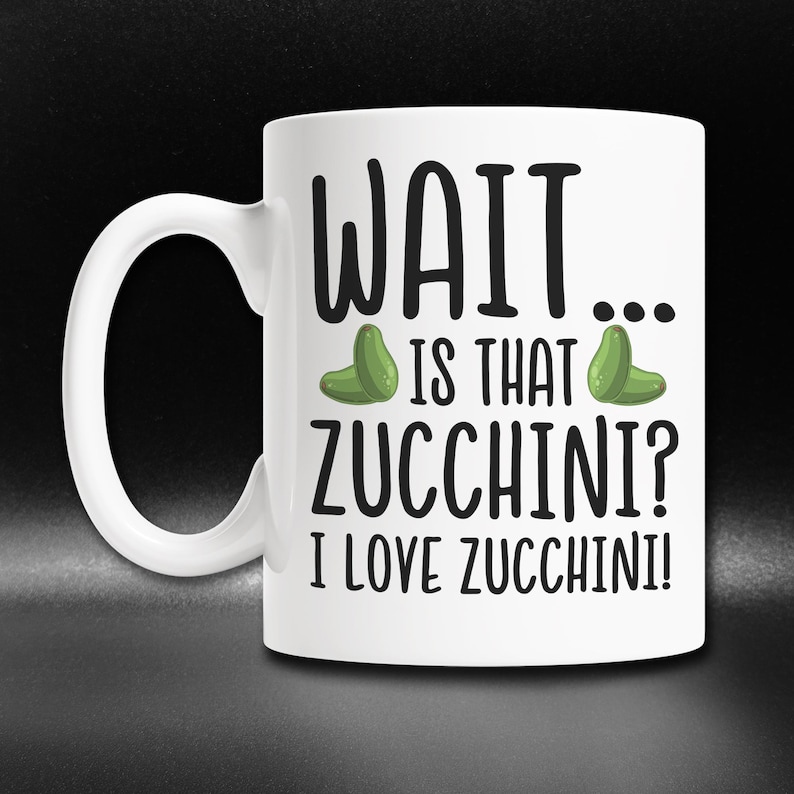 May include: White ceramic mug with a black and green design. The mug says "WAIT... IS THAT ZUCCHINI? I LOVE ZUCCHINI!"