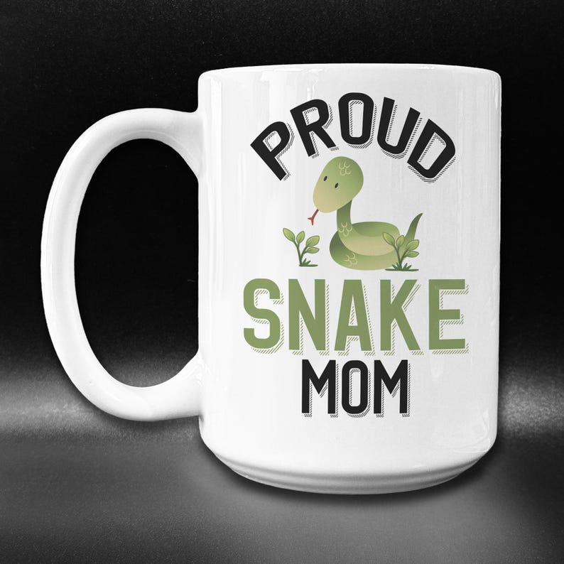May include: White ceramic coffee mug with a green snake illustration and the text "Proud Snake Mom".