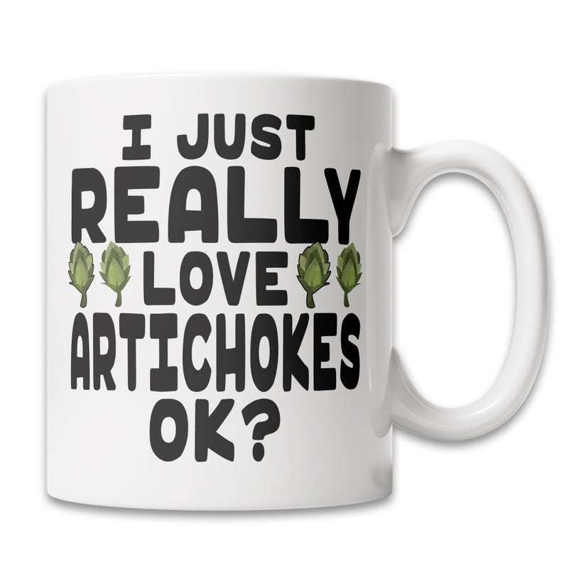 May include: White ceramic coffee mug with black text that reads "I just really love artichokes ok?" with three green artichoke illustrations.