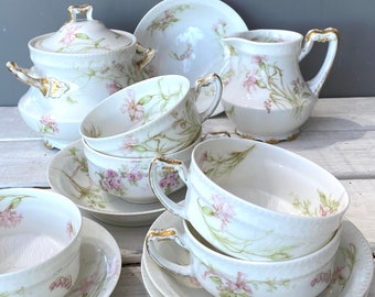 Antique french porcelain set by Haviland Limoges in the most beautiful florals.  Sold as set.