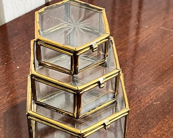 A trio of vintage glass & brass trinket boxes
