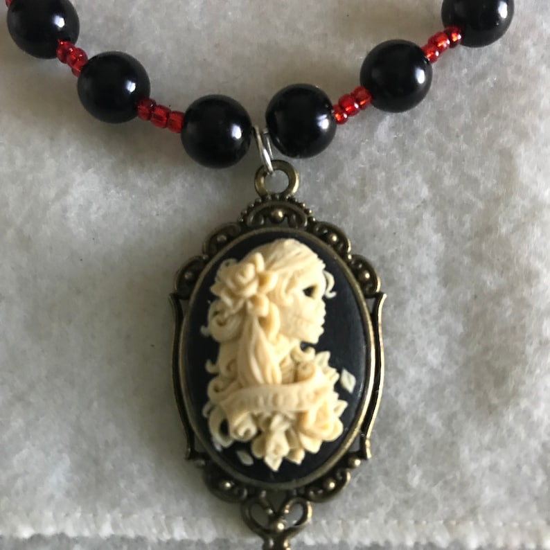 Beaded necklace with Dia de Muertos cameo pendant and pin set