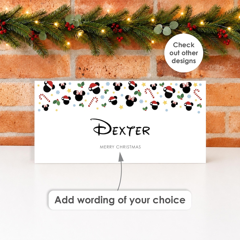 May include: A rectangular white sign featuring a pattern of black mouse silhouettes wearing Santa hats and bows, interspersed with candy canes, holly, and stars. The text reads Dexter and Merry Christmas, with an arrow pointing to the text.