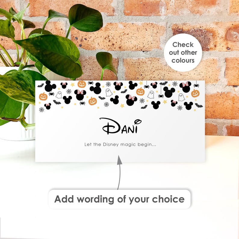 May include: A rectangular white card featuring a Halloween-themed pattern of black Mickey Mouse silhouettes, orange pumpkins, white ghosts, and spiders. The center displays the name Dani in a stylized font with the text Let the Disney magic begin.